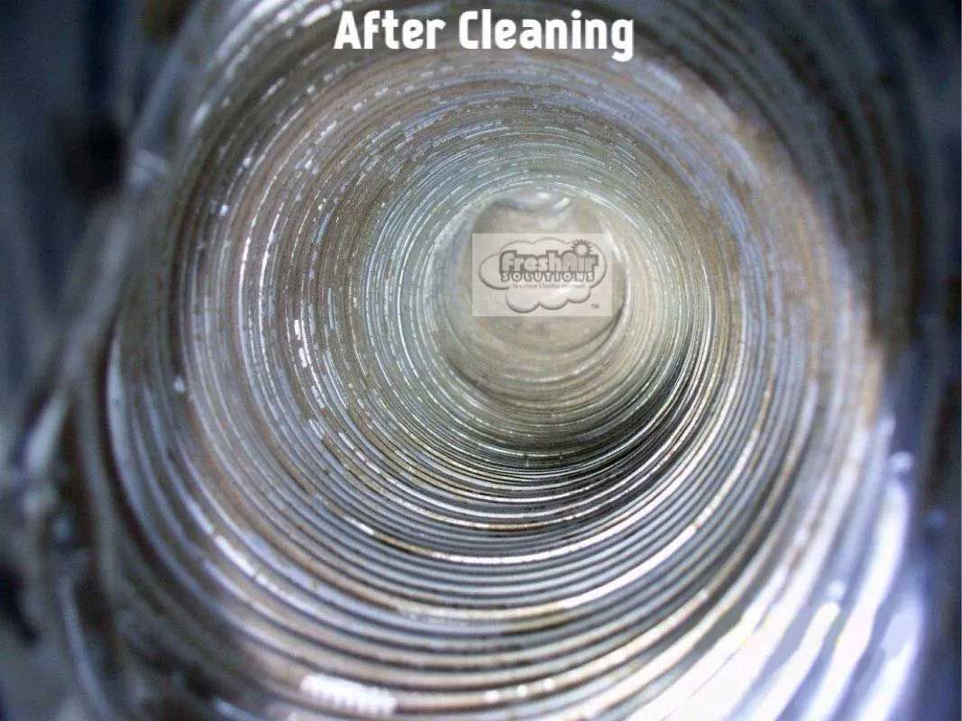 Dirty air duct interior before cleaning, filled with thick layers of dust and debris.